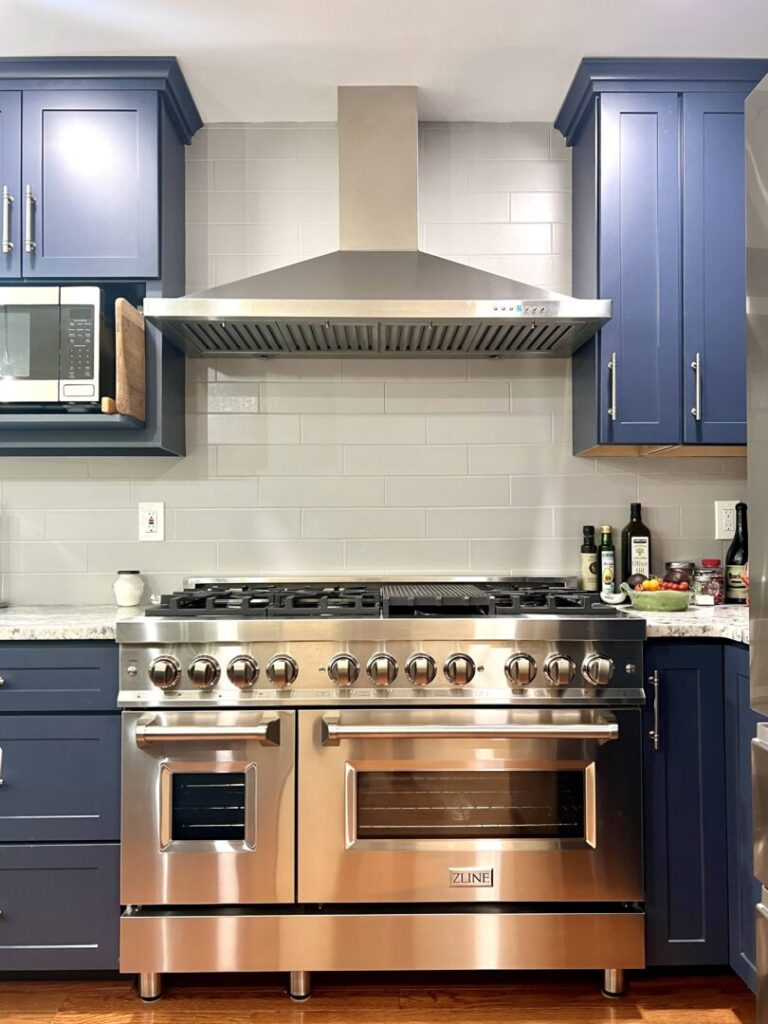 kitchen remodel with large range and hood vent